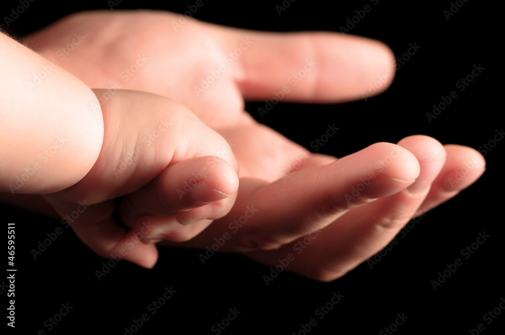 Baby hands with fathers