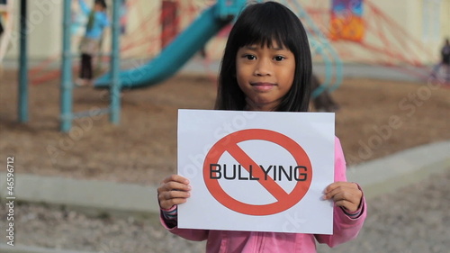 Cute Asian Girl With Large NO BULLYING sign
