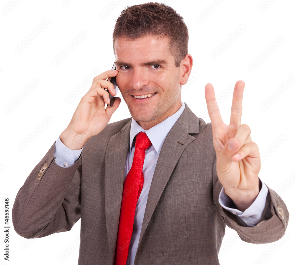 business man on the phone victory sign