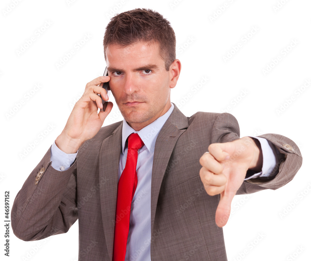 business man talking on the phone and showing thumbs down business man talking on the phone and showing thumbs down