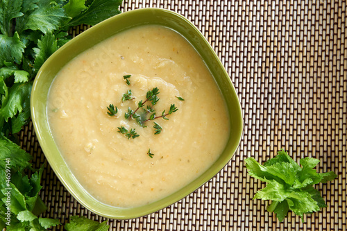 Tasty cream of celeriac soup in a green bowl