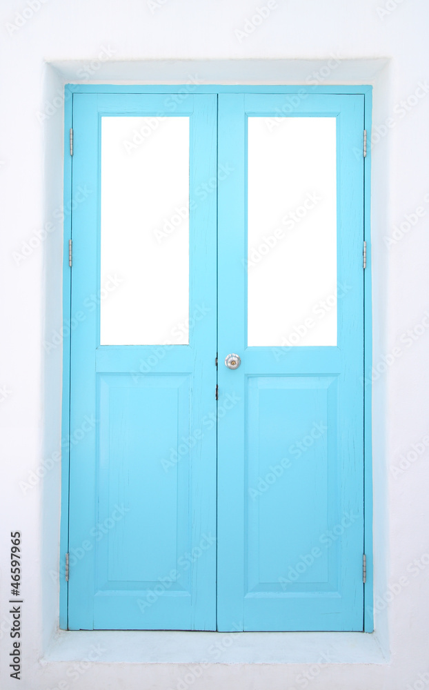 Light blue wooden door with cement wall. Light blue wooden door with cement wall.