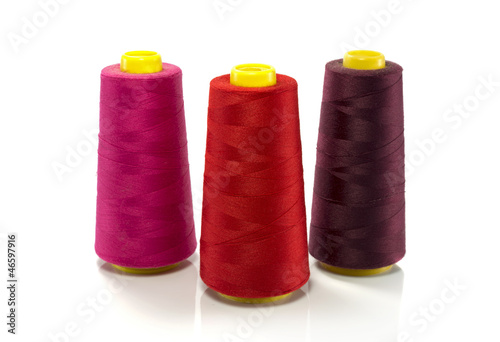 red pink and purple bobbin with thread