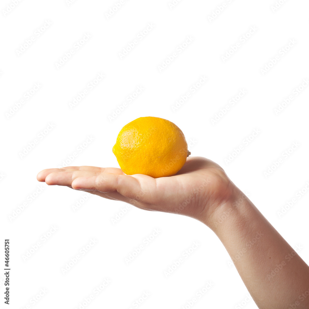 Young caucasian female hand holding a fresh yellow lemon isolate Young caucasian female hand holding a fresh yellow lemon isolate