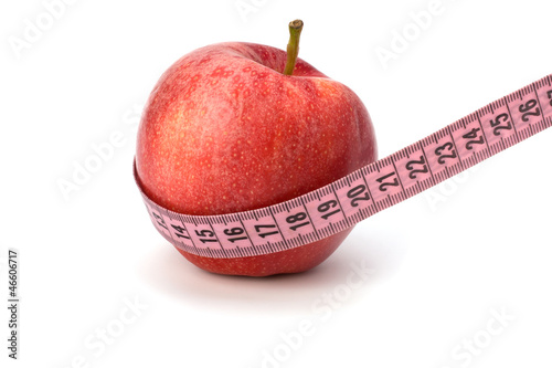 Apple with tape measure. Healthy lifestyle concept.