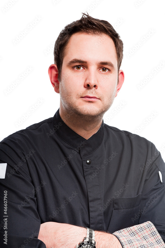 Young male cook with black cooks jacket isolated on white. Young male cook with black cooks jacket isolated on white.