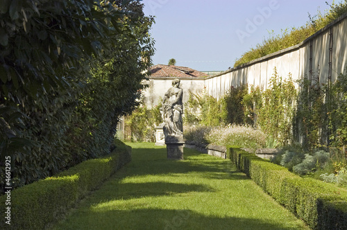 Formal garden with wall and sculpture