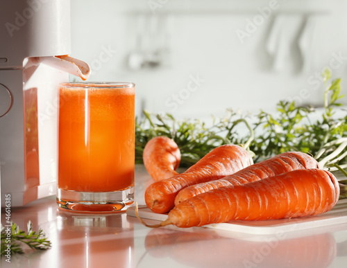 Fresh carrot juice and juicer photo