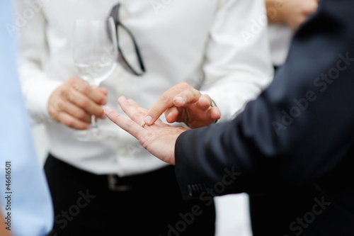 Groom showing his wedding ring