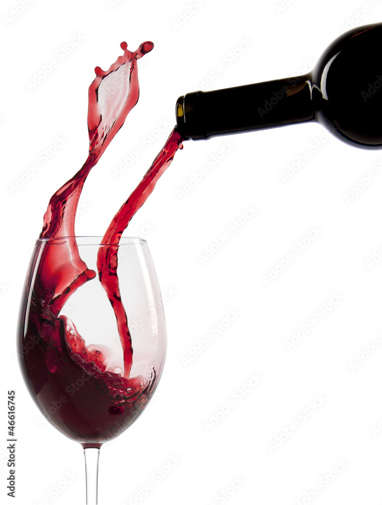 Pouring red wine in a glass - obrazy, fototapety, plakaty 