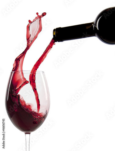 Pouring red wine in a glass