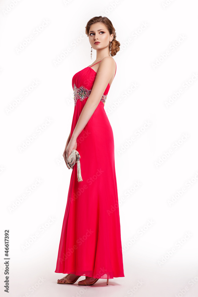 Fashion young woman in luxury red long dress with handbag Fashion young woman in luxury red long dress with handbag