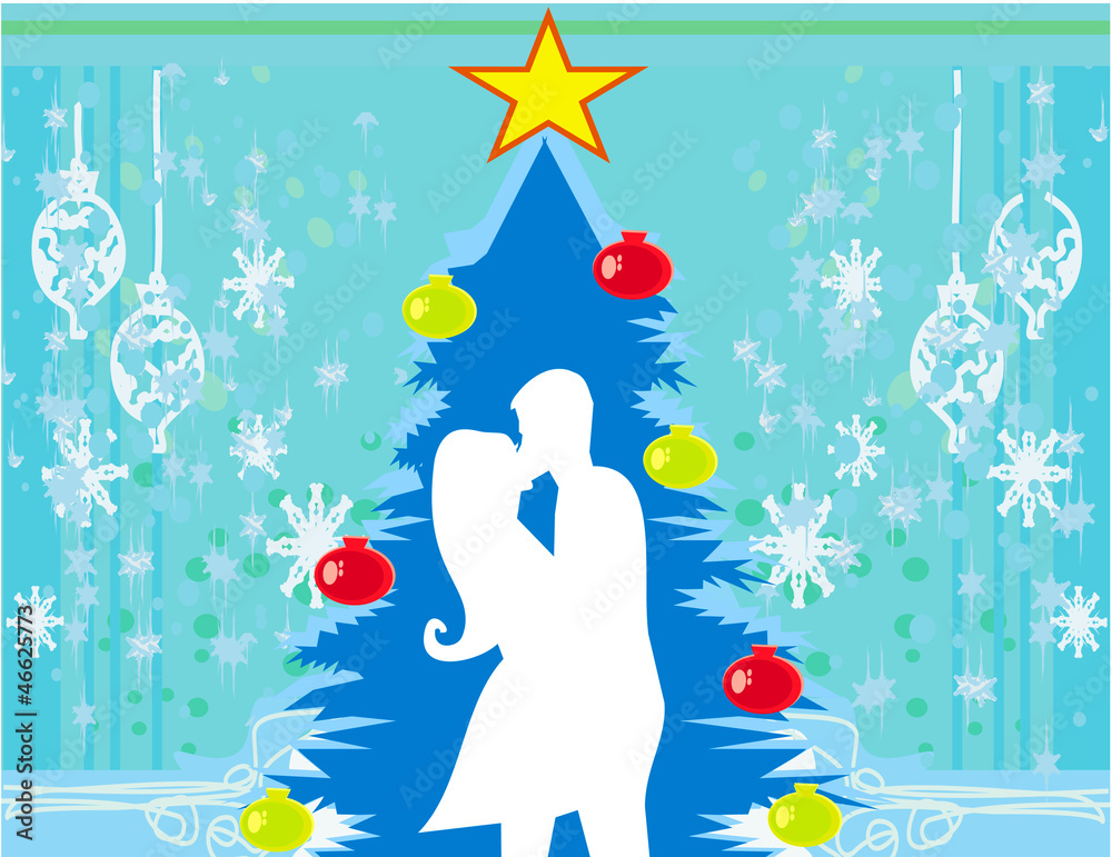 Couple kissing by a Christmas tree Couple kissing by a Christmas tree