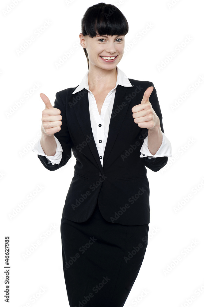 Successful businesswoman gesturing thumbs up Successful businesswoman gesturing thumbs up