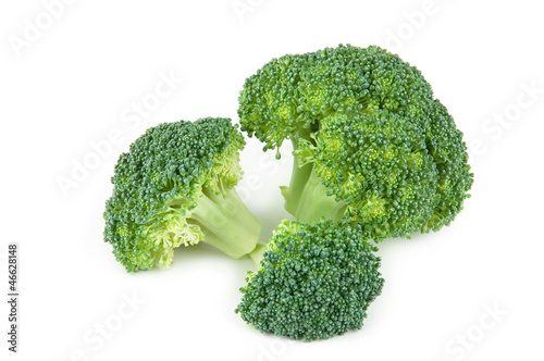 Pieces of fresh raw broccoli over white background
