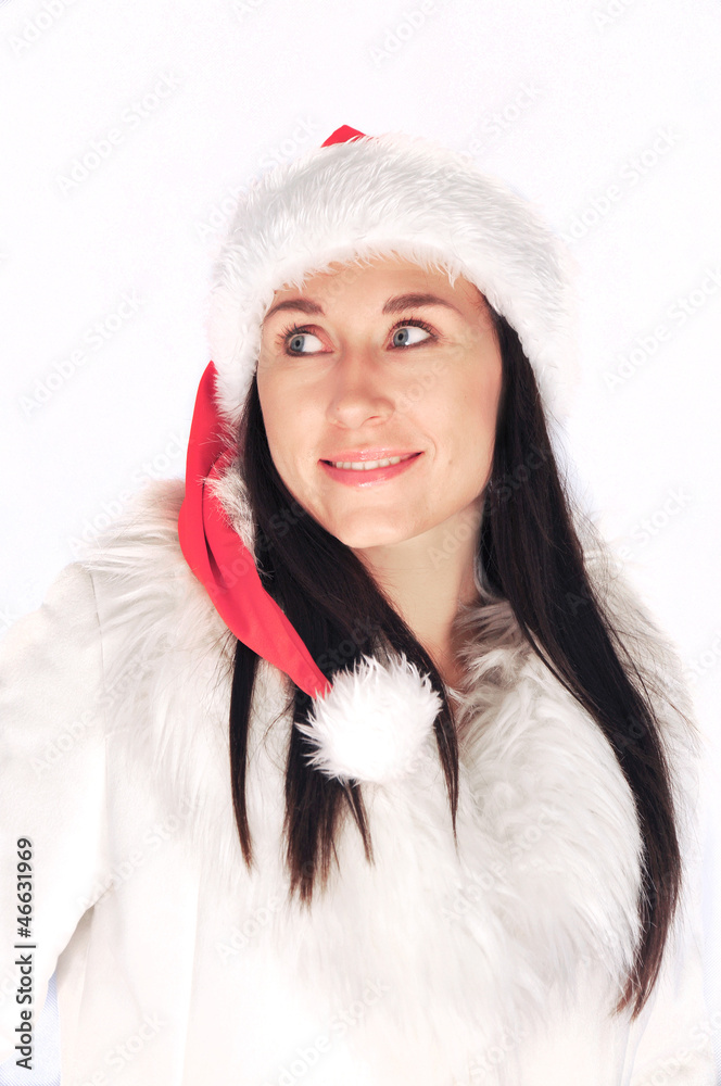 Brunette woman isolated in winter christmas fur and santa hat Brunette woman isolated in winter christmas fur and santa hat