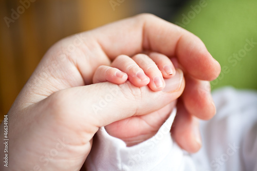 Babys Hand in Mamas Hand photo