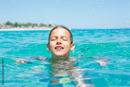 Young girl playing in the sea