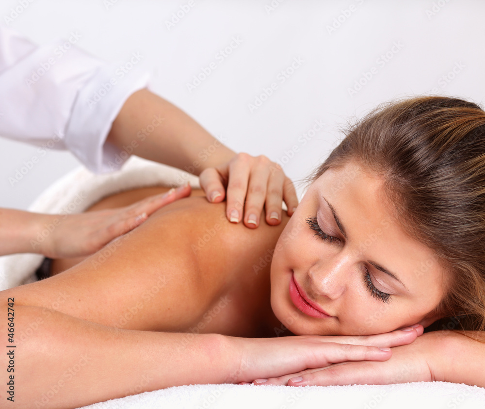 Closeup of an attractive young woman receiving massage Closeup of an attractive young woman receiving massage