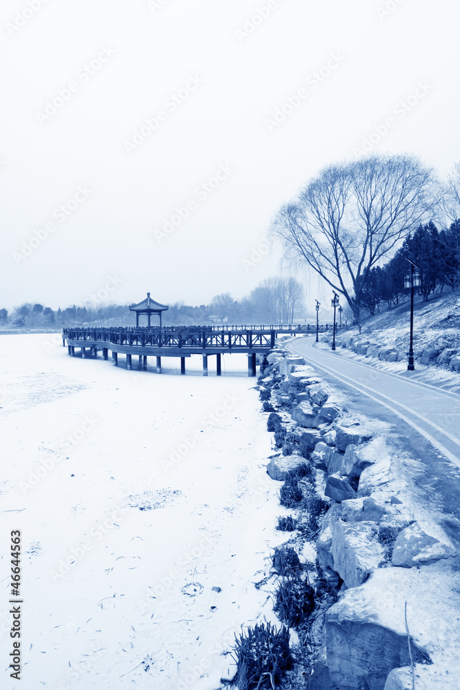 Chinese traditional style wooden bridge in the snow
