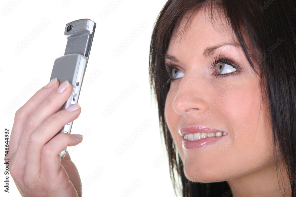 Woman taking picture with mobile phone Woman taking picture with mobile phone