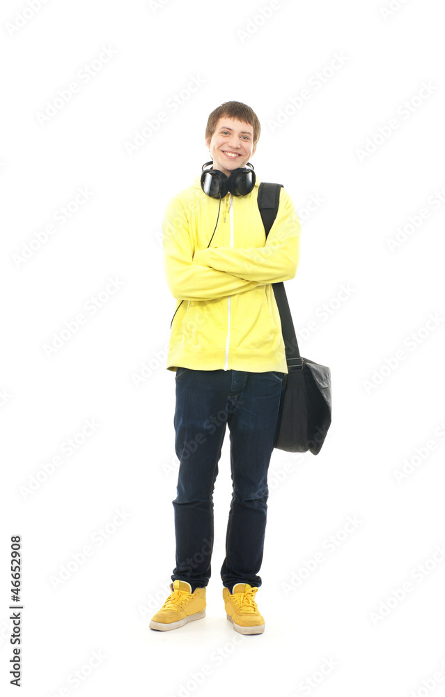 A happy teenage guy in modern clothes with a school bag A happy teenage guy in modern clothes with a school bag