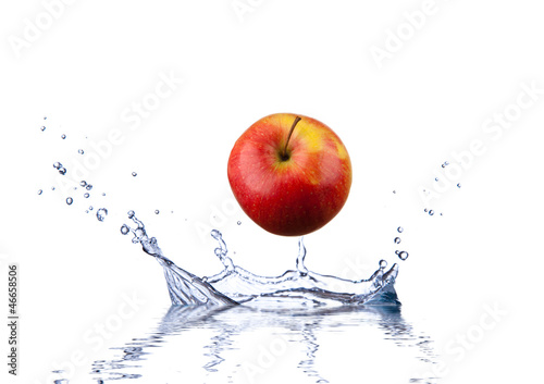 Red apple splashing into water depth 