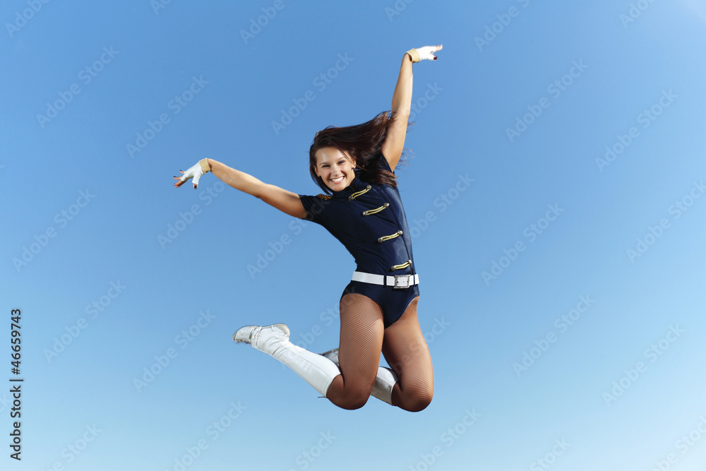 Young female dancer against white background Young female dancer against white background