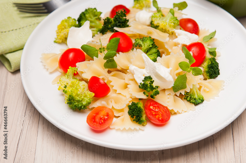 Farfalle pasta with broccoli and cherry tomatoes