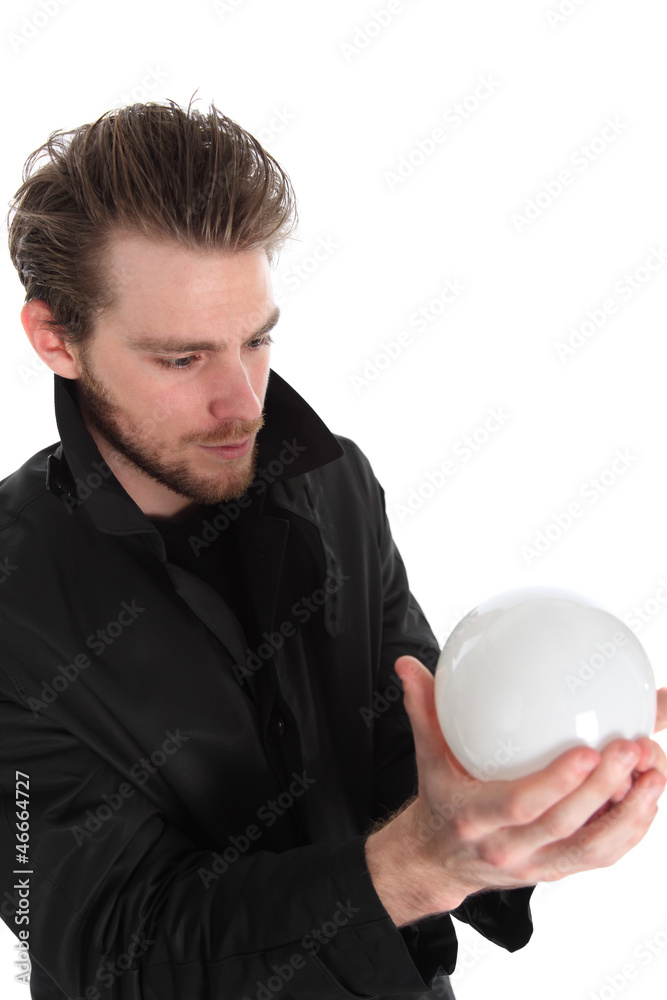 Man holding a glass ball