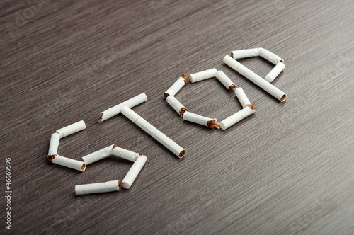 Canvastavla concept of dangers of smoking. word stop of cigarettes
