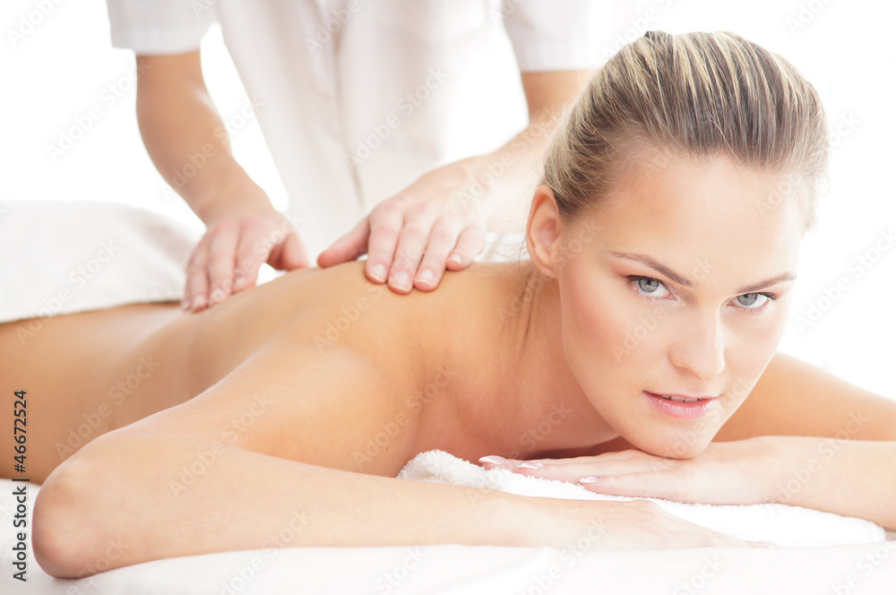 A young woman laying on a spa massage procedure