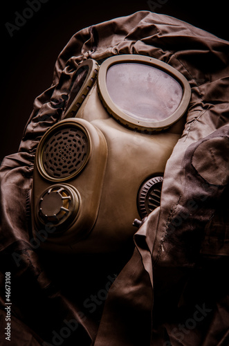 Man with a gas mask wearing hazmat suit - close up