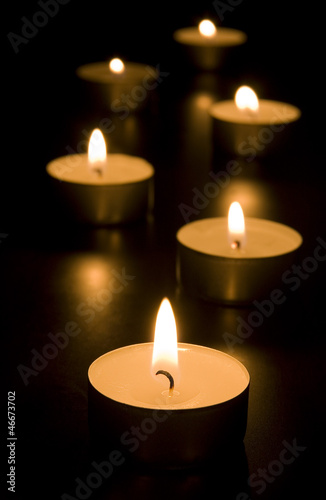 Small candles in dark. Holiday/romance/religion concept