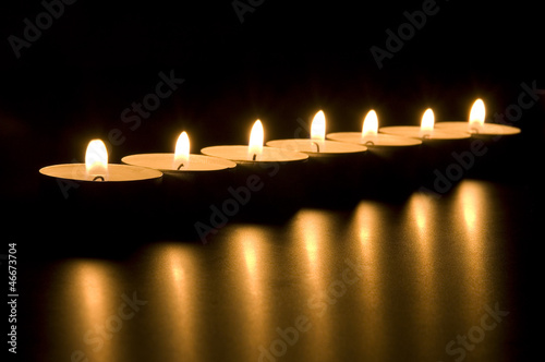 Small candles in dark. Holiday/romance/meditation concept