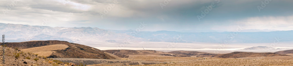 Death Valley with dramatic cloudy sky. Desert. USA, California. Death Valley with dramatic cloudy sky. Desert. USA, California.