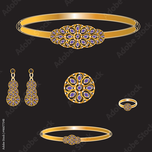 golden set from necklace ring earrings brooch and bracelet
