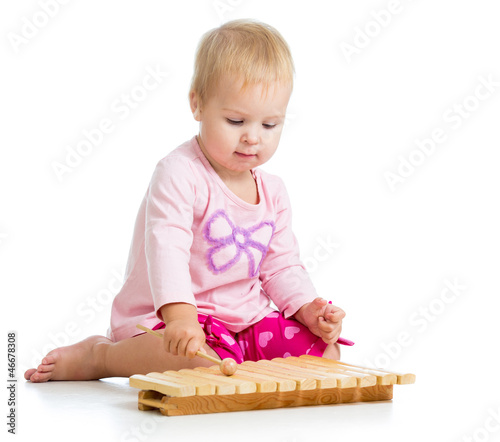 little girl playing with mu...