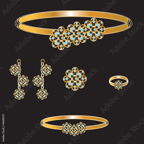 golden set from necklace ring earrings brooch and bracelets