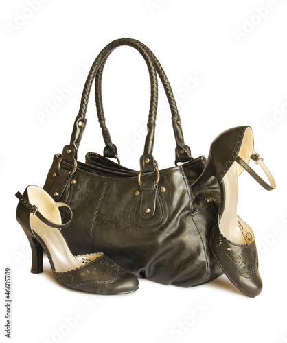 Black bag with shoes isolated on white (with clipping path)