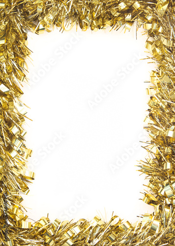 Gold Christmas tinsel, forming border on white background