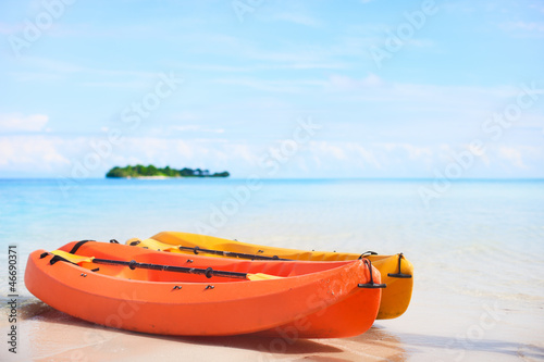 Two kayaks at tropical beach