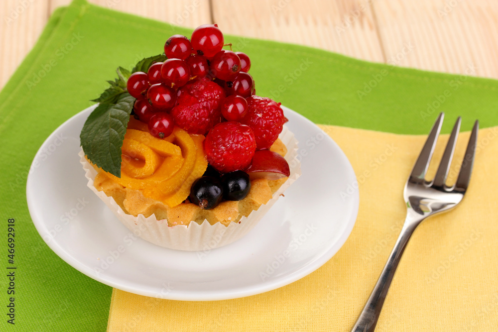 Dulcet cake with fruit and berries on wooden table Dulcet cake with fruit and berries on wooden table