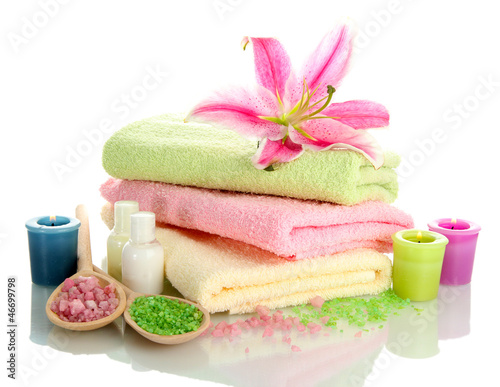 Fototapeta Naklejka Na Ścianę i Meble -  towels with lily, aroma oil,  candles and sea salt isolated