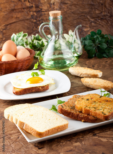 White bread with fried egg and parsley
