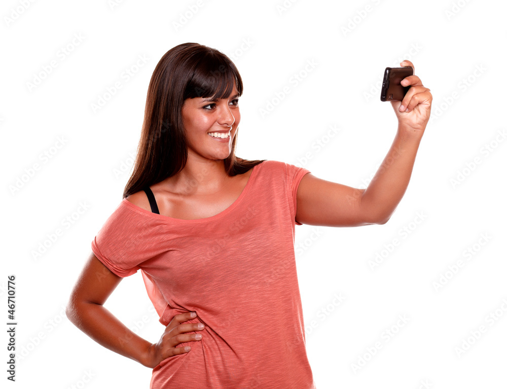 Smiling woman taking a picture with her mobile Smiling woman taking a picture with her mobile