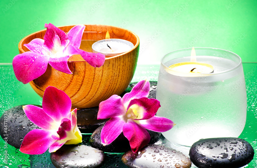 Image of spa therapy, flowers in water, on a bamboo mat. Image of spa therapy, flowers in water, on a bamboo mat.