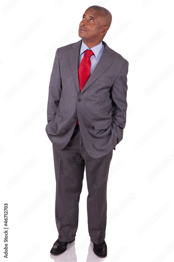 American business man standing on white with hands in pocket