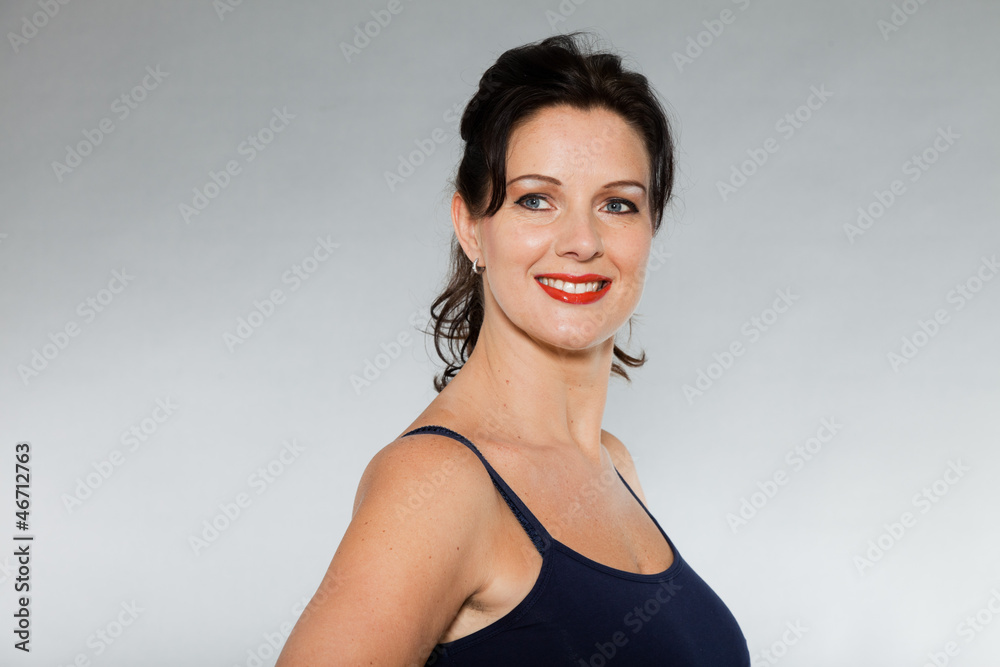 Pretty brunette woman with red lipstick studio shot. Pretty brunette woman with red lipstick studio shot.