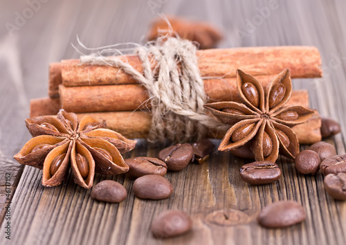 cinnamon sticks tied with twine, coffee and star anise
